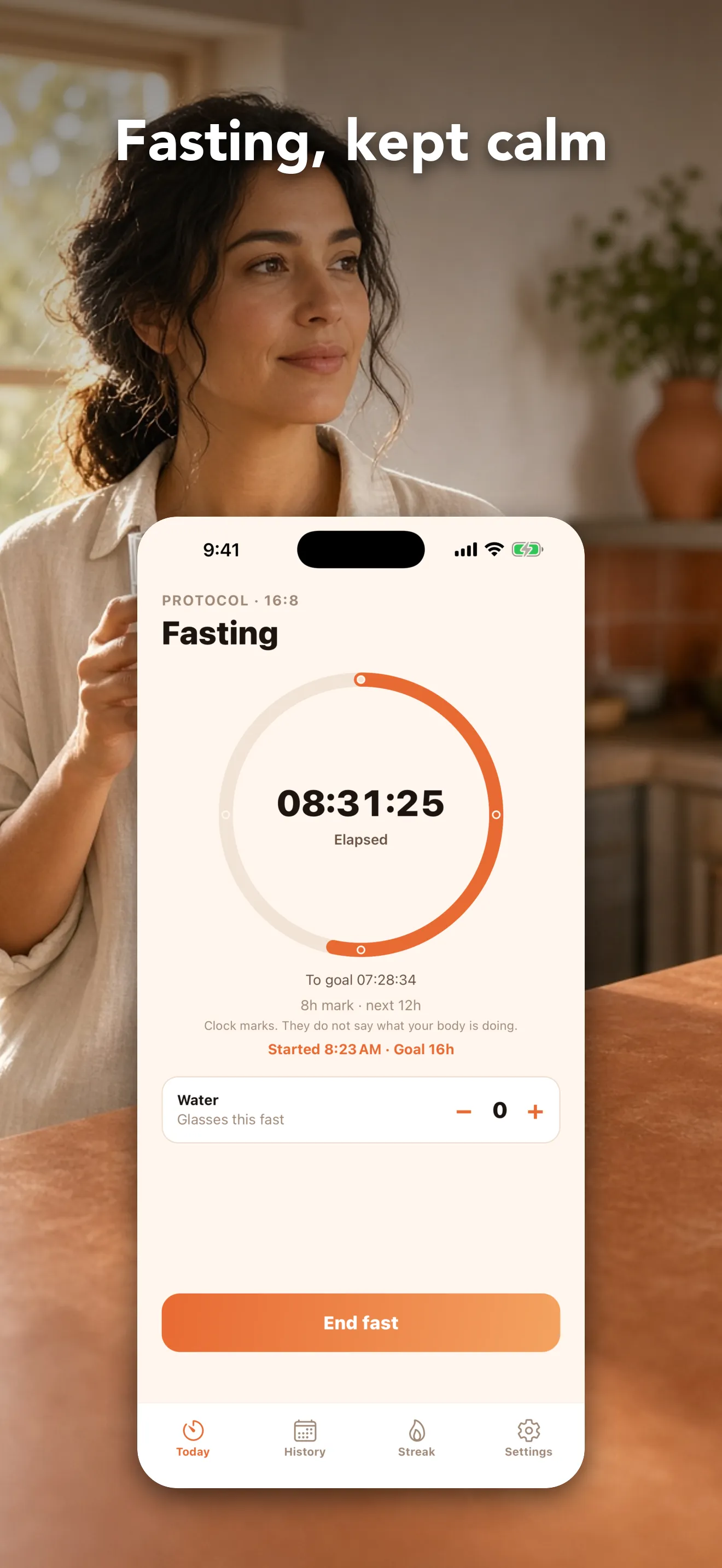 Woman in her kitchen holding an iPhone with Fastii open